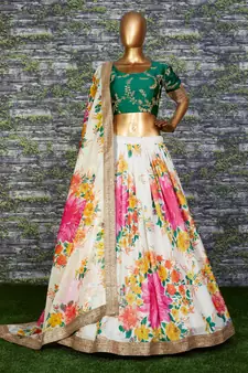 Engrossing Cream Floral Designer Lehenga with rich embroidered Green Blouse and Dupatta