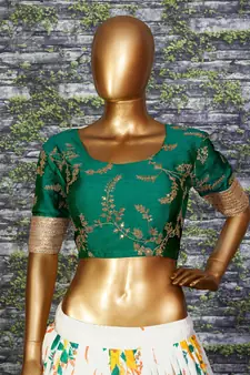 Engrossing Cream Floral Designer Lehenga with rich embroidered Green Blouse and Dupatta