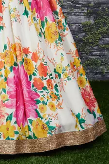 Engrossing Cream Floral Designer Lehenga with rich embroidered Green Blouse and Dupatta