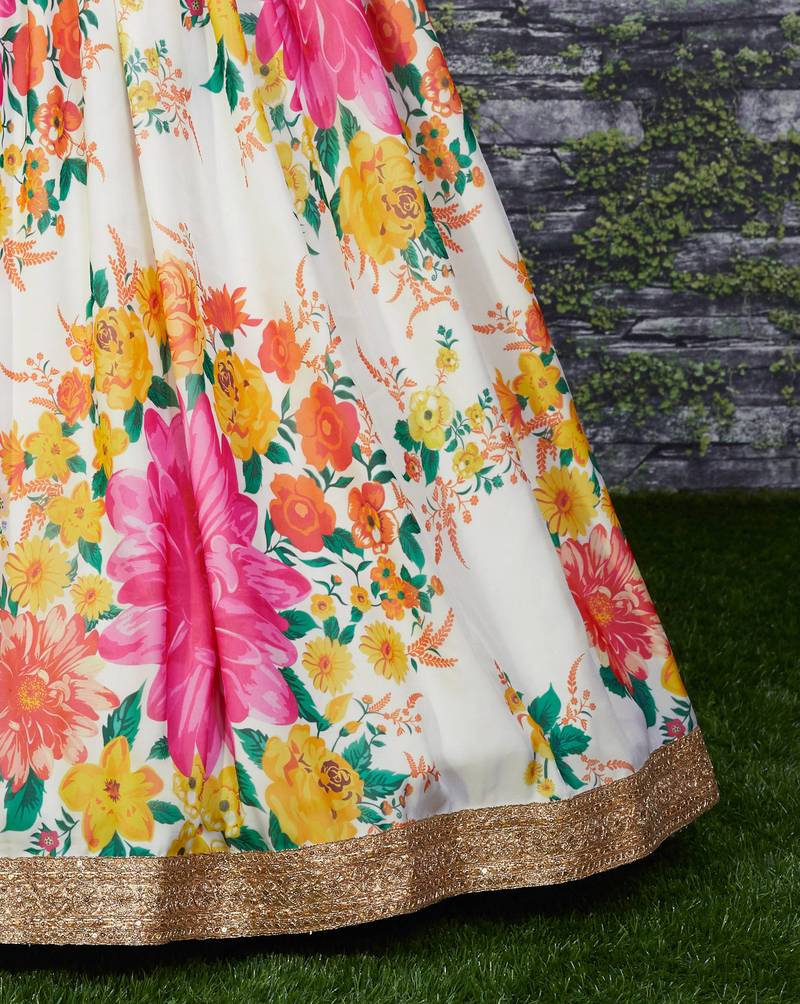 Engrossing Cream Floral Designer Lehenga with rich embroidered Green Blouse and Dupatta