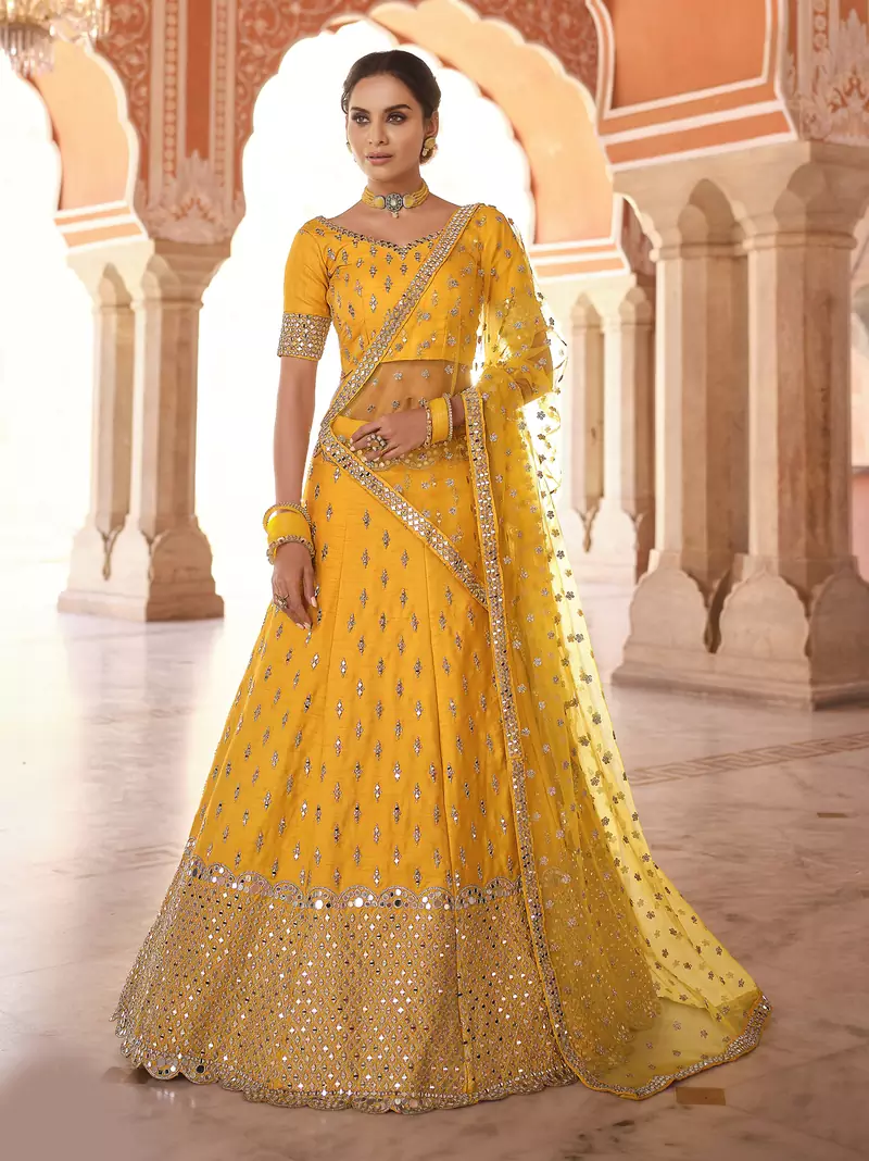 interesting mustard real mirror, zari embroidered art silk semi stitched lehenga