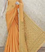 Orange embroidered georgette saree with blouse