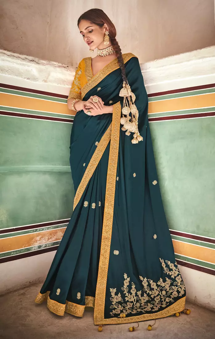 Green embroidered crepe saree with blouse
