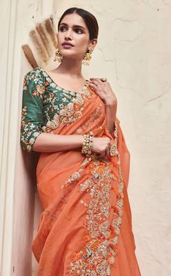 Orange embroidered organza saree with blouse 2