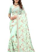 Sky blue embroidered organza saree with blouse