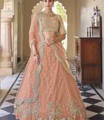 Peach embroidered net semi stitched lehenga