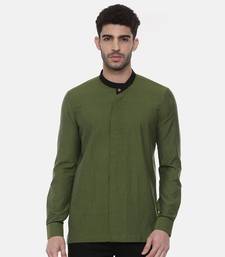 green malai cotton short kurta with contrast black collar. pair with denims or linen pants.