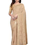 Beige embroidered georgette saree with blouse