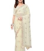 Cream embroidered georgette saree with blouse