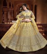 Delightful Yellow Zari, Sequins and thread Embroidered net Semi Stitched Lehenga