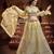 Delightful Yellow Zari, Sequins and thread Embroidered net semi stitched lehenga