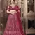 Engaging Maroon thread and sequins embroidered net semi stitched lehenga