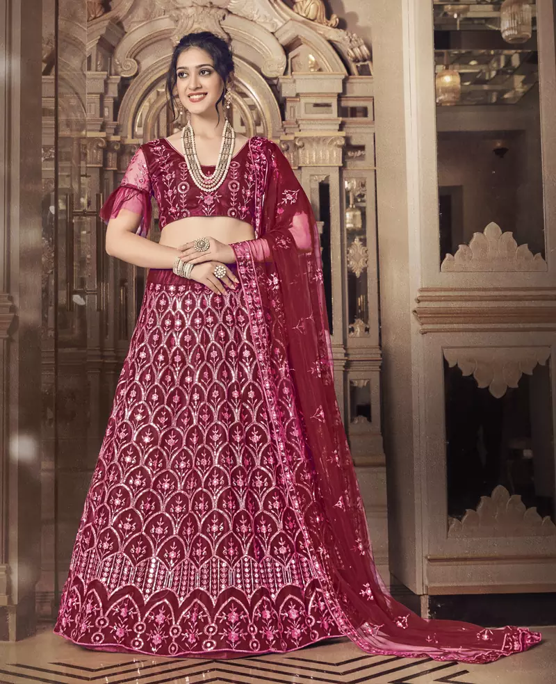 Engaging Maroon thread and sequins embroidered net semi stitched lehenga