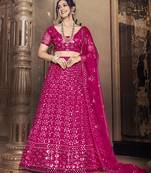 Alluring Rani pink thread and sequins embroidered net wedding Lehenga choli