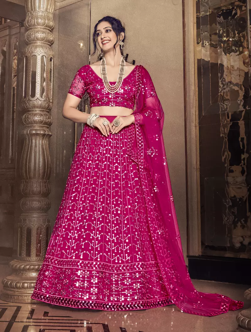 Alluring Rani pink thread and sequins embroidered net semi stitched lehenga