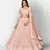 Comely Peach embroidered net semi stitched lehenga