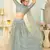 appetizing Light-blue thread embroidery net semi stitched lehenga