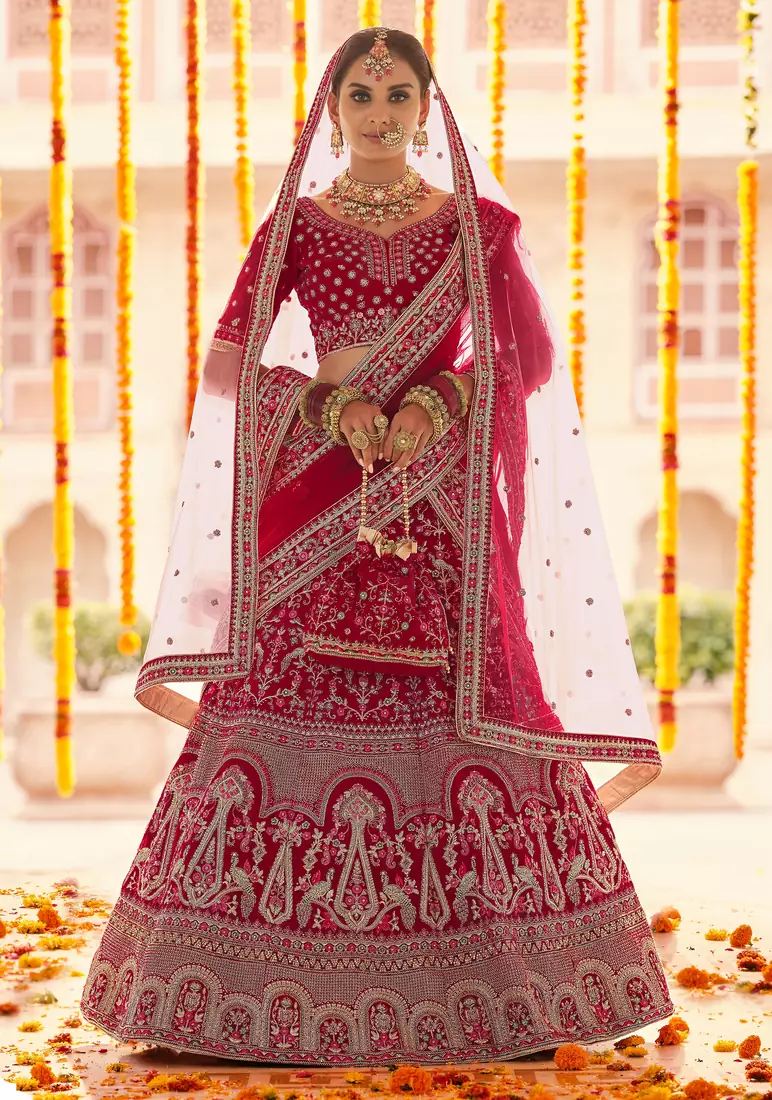 Red Zari, zarkan, zardosi and thread embroidered velvet semi stitched wedding lehenga