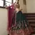 Green & Deep Pink Gotta patti with thread and sequins embroidered georgette semi stitched lehenga