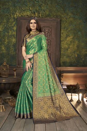 Green woven banarasi silk saree with blouse