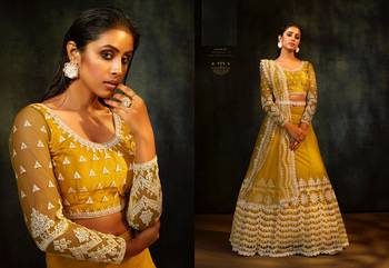 Yellow embroidered net semi stitched lehenga 2