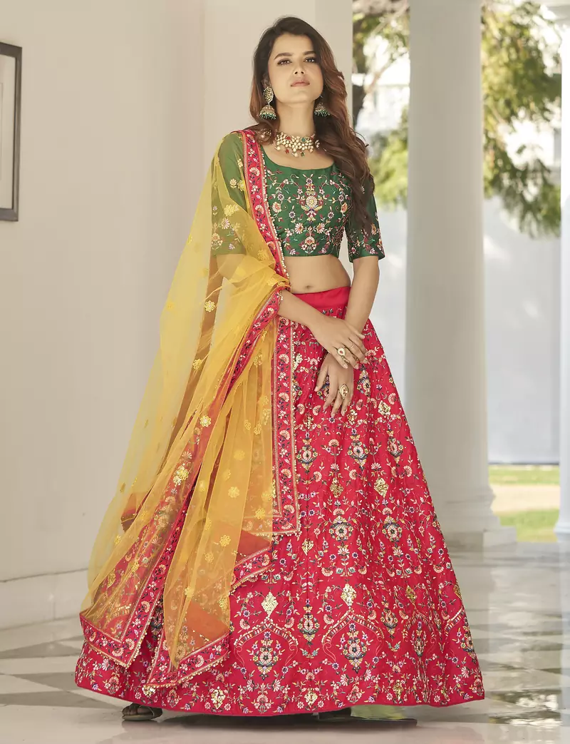 Red, green and yellow colored thread and sequins embroidered silk semi stitched lehenga