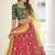 Red, green and yellow colored thread and sequins embroidered silk semi stitched lehenga
