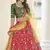 Red, green and yellow colored thread and sequins embroidered silk semi stitched lehenga