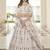 White thread and sequins embroidered silk semi stitched lehenga