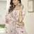 White thread and sequins embroidered silk semi stitched lehenga
