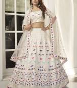 Engaging White thread and sequins embroidered Silk Semi Stitched Lehenga
