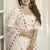 White thread and sequins embroidered silk semi stitched lehenga