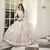 White thread and sequins embroidered silk semi stitched lehenga