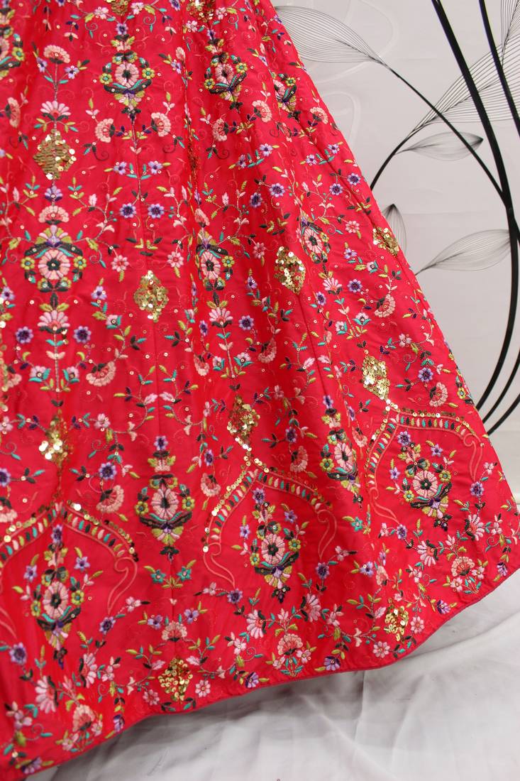 Red, green and yellow colored thread and sequins embroidered silk semi stitched lehenga