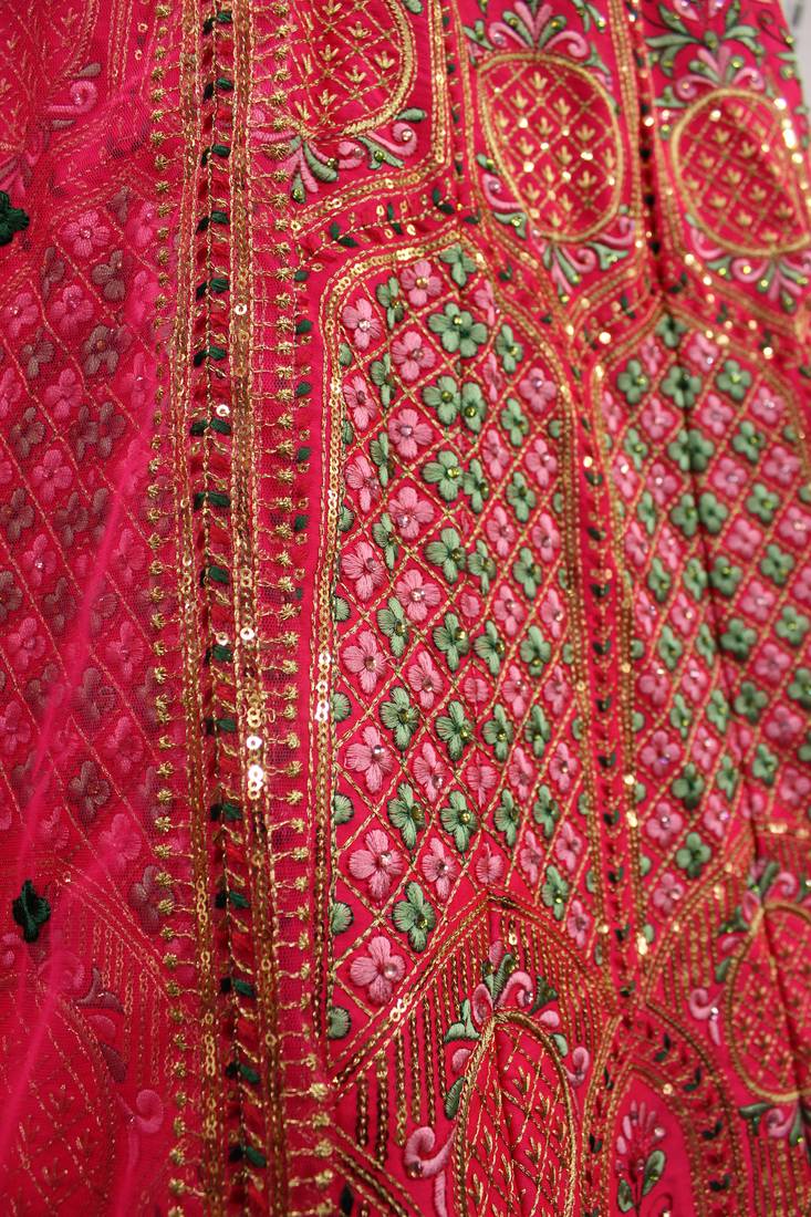 Hypnotizing Deep pink thread and Sequins embroidered silk semi stitched lehenga
