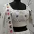 White thread and sequins embroidered silk semi stitched lehenga