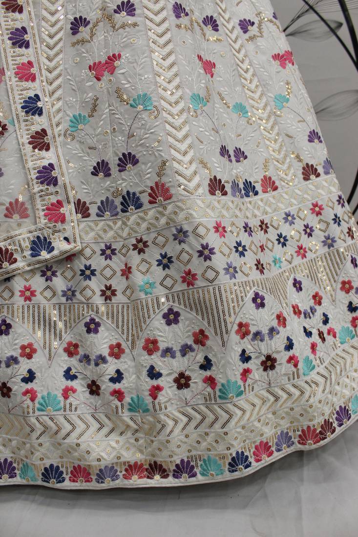 Engaging White thread and sequins embroidered Silk Semi Stitched Lehenga
