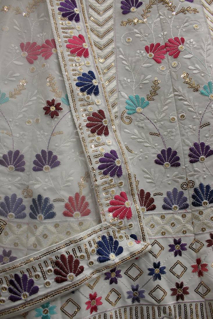 Engaging White thread and sequins embroidered Silk Semi Stitched Lehenga