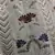 White thread and sequins embroidered silk semi stitched lehenga