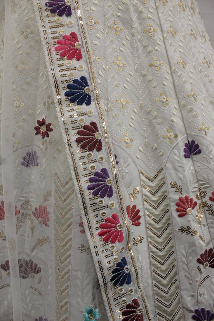 Engaging White thread and sequins embroidered Silk Semi Stitched Lehenga