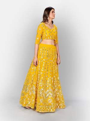 Yellow and SilverToned Embellished Mirror Work Semi stitched Lehenga and Unstitched Blouse With 7