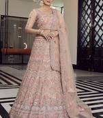 hypnotizing peach colored mirror, zari, zarkan, and thread embroidered organza wedding Lehenga choli
