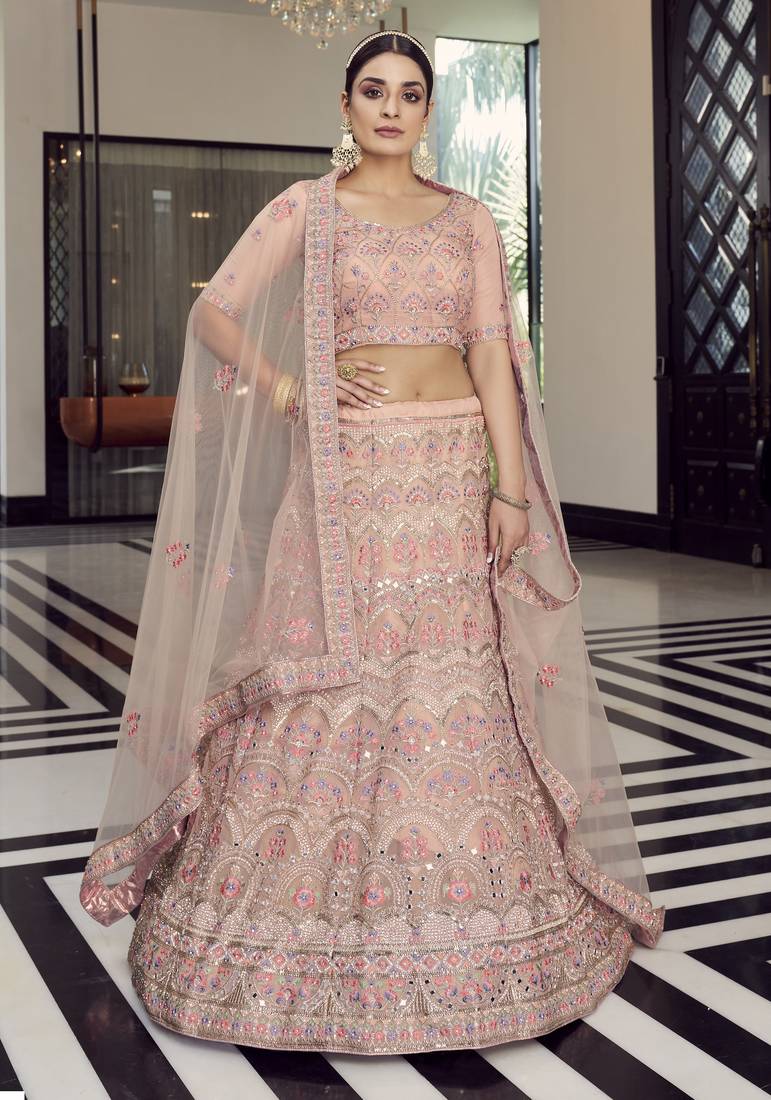 hypnotizing peach colored mirror, zari, zarkan, and thread embroidered organza wedding Lehenga choli