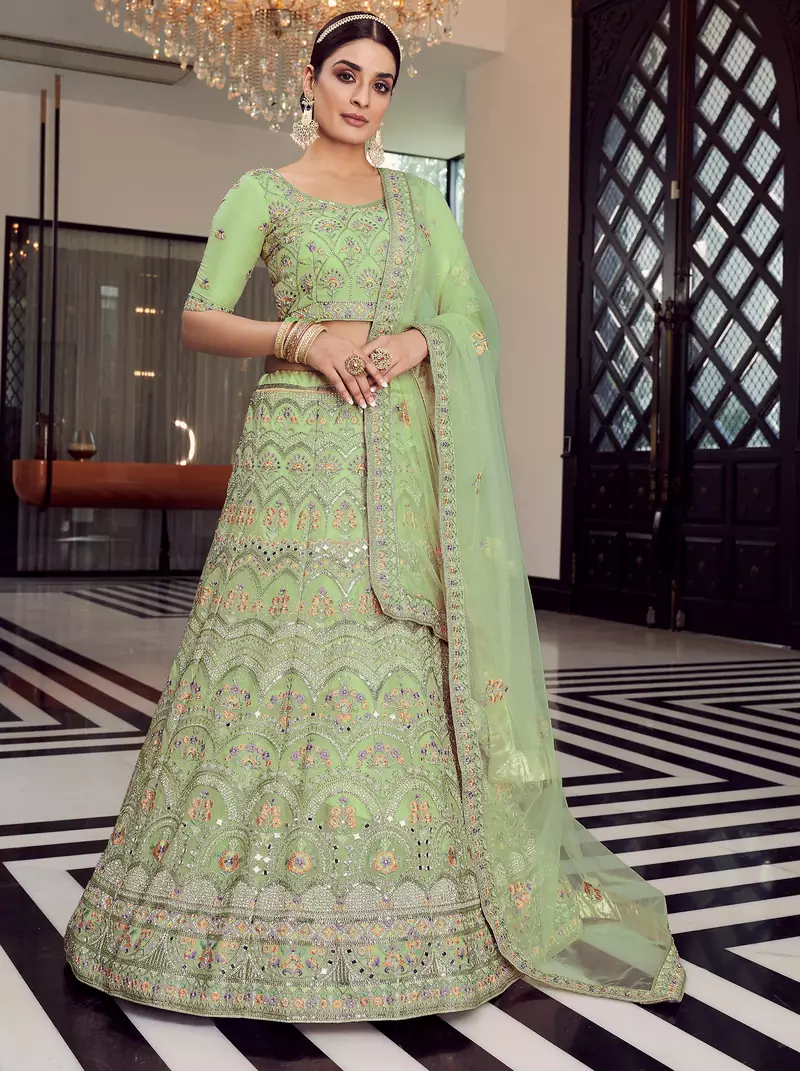 pista green colored mirror, zari, zarkan, thread, embroidered organza semi stitched lehenga