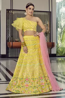 Delightful Yellow thread embroidered with mirror work art Silk party wear Lehenga choli