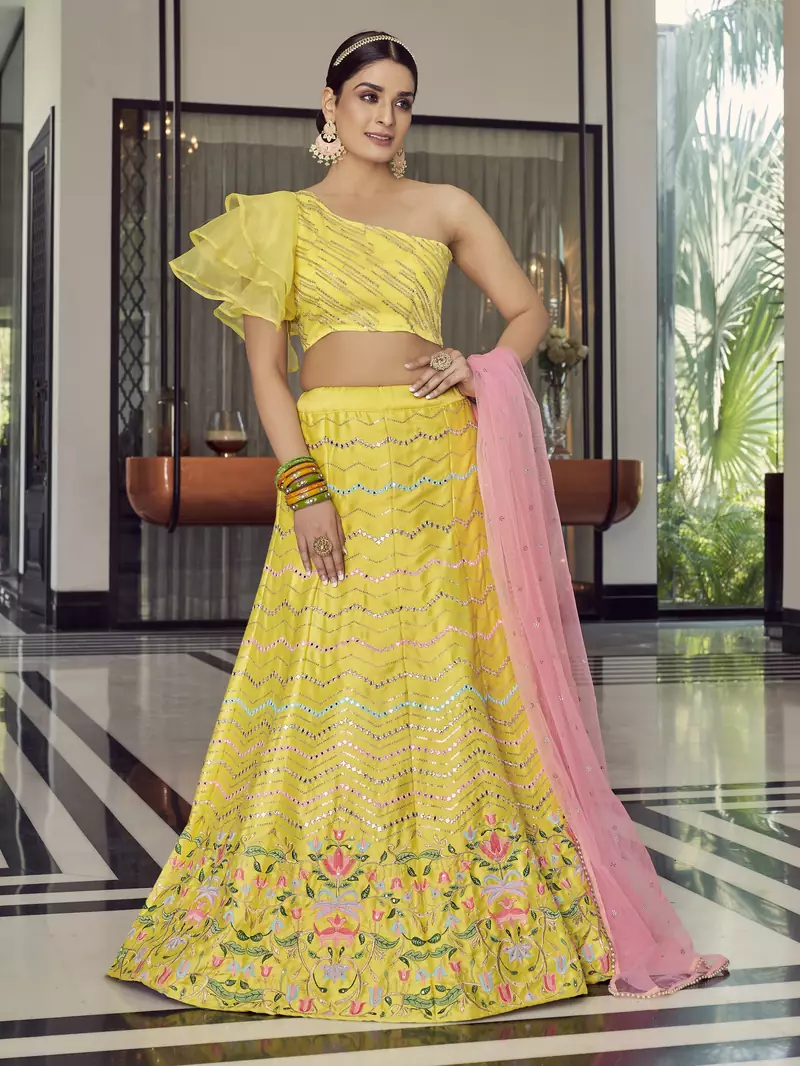 Delightful Yellow thread embroidered with mirror work art Silk party wear Lehenga choli