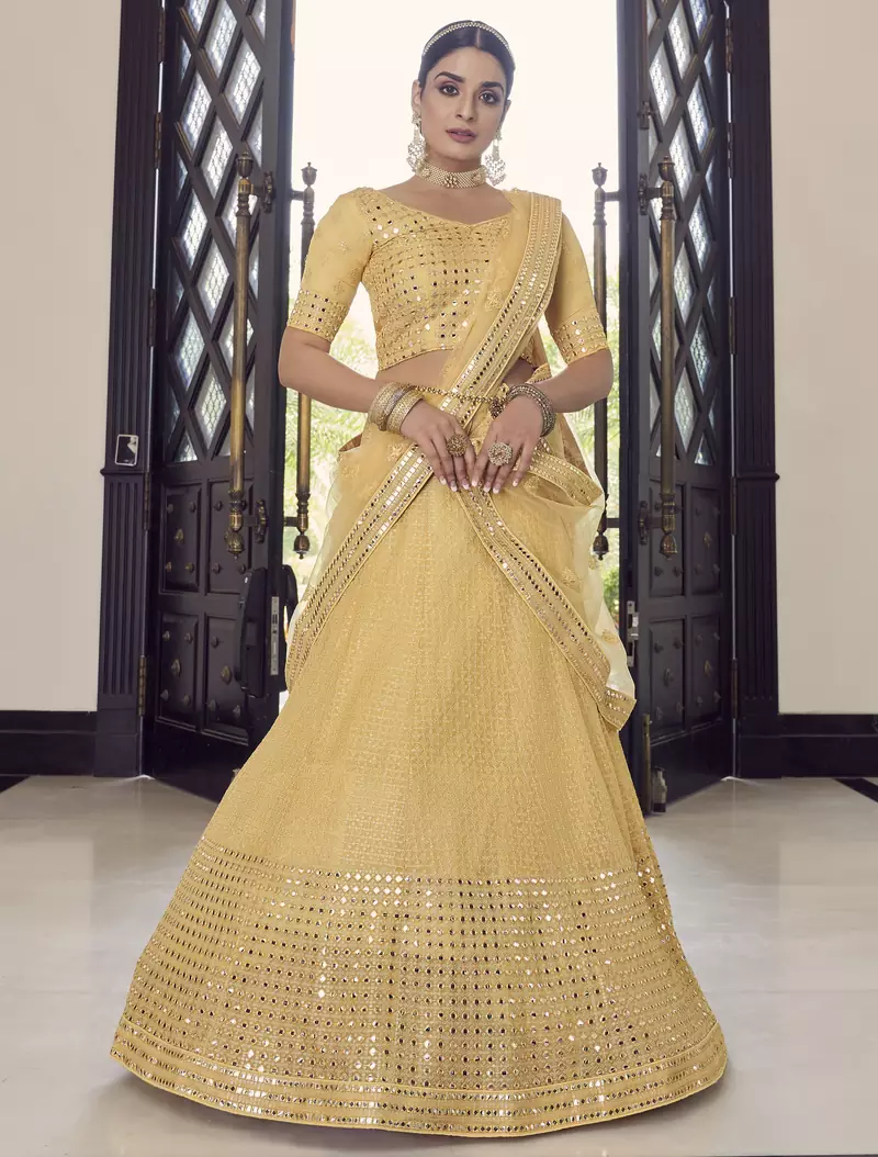 yellow colored sequins, foil mirror, thread, embroidered georgette semi stitched lehenga