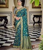 Dark teal woven banarasi saree with blouse