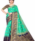 Green woven faux kanjivaram silk saree with blouse