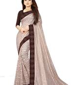 Beige embroidered net saree with blouse